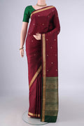 Pure Silk Maroon Kanjivaram Saree with Thread Butta on the body and Thread Border.  displayed on a mannequin