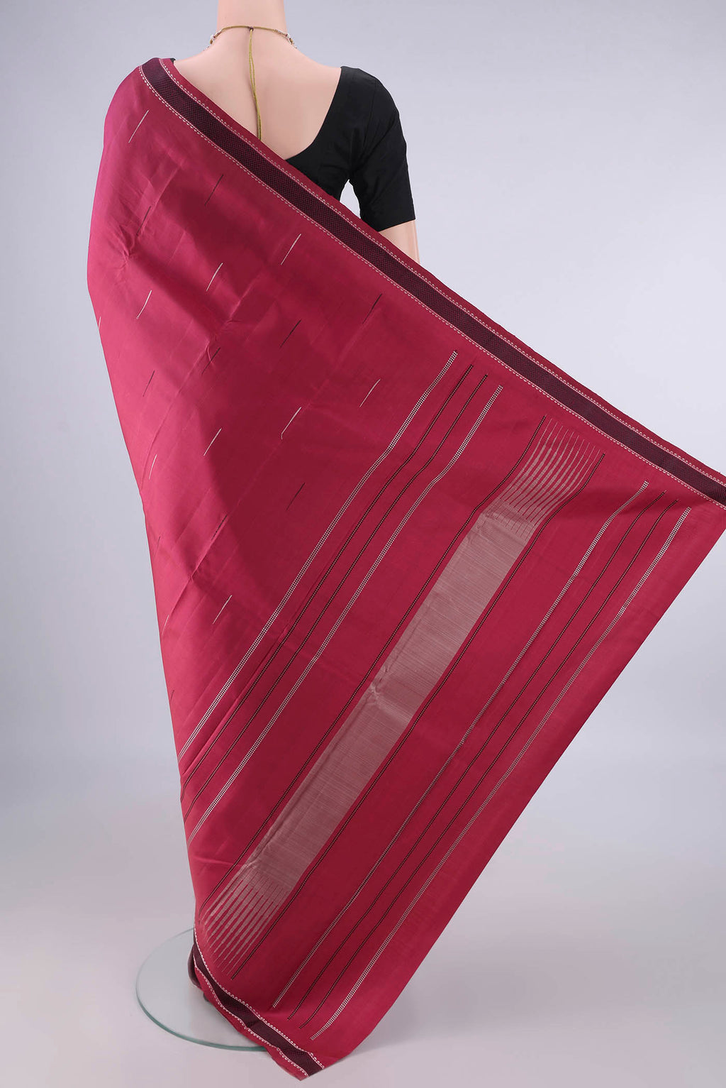 Flat view of Pure Silk Dark Pink Kanjivaram Saree with Thread Butta on the body and Thread Border. 