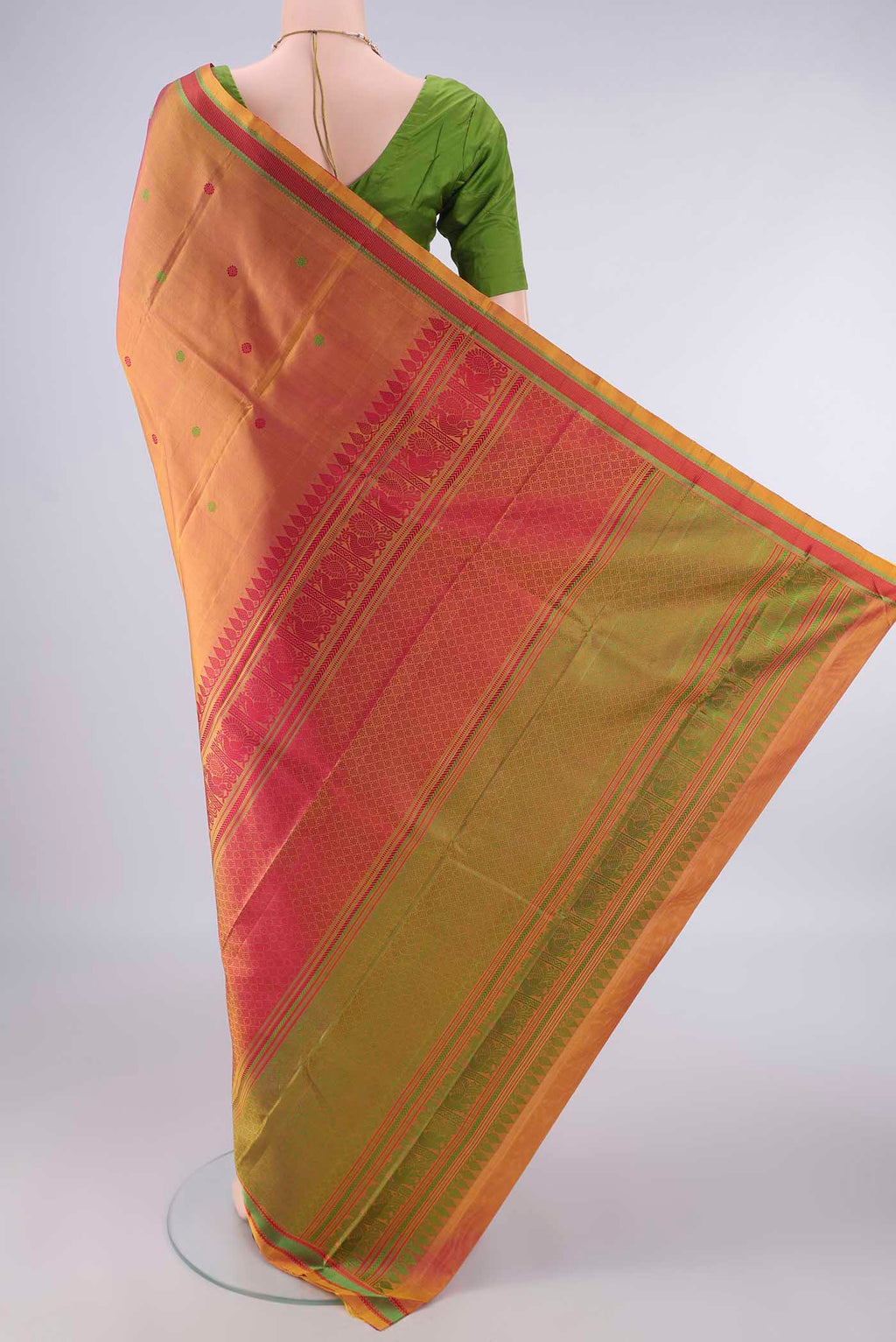 Flat view of Pure Silk Pinkish Yellow Dual Tone Kanjivaram Saree with Thread Butta on the body and Thread Border. 