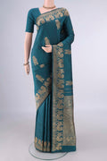 Pure Silk Teal Kanjivaram Saree with Thread Butta on the body and Thread Border.  displayed on a mannequin