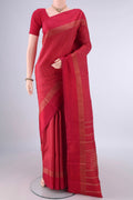 Pure Silk Red Kanjivaram Saree with Checked design on the body and Zari Border.  displayed on a mannequin