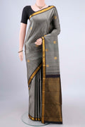 Pure Silk Grey Kanchipuram Saree with Zari Butta on the body and Zari Border.  displayed on a mannequin