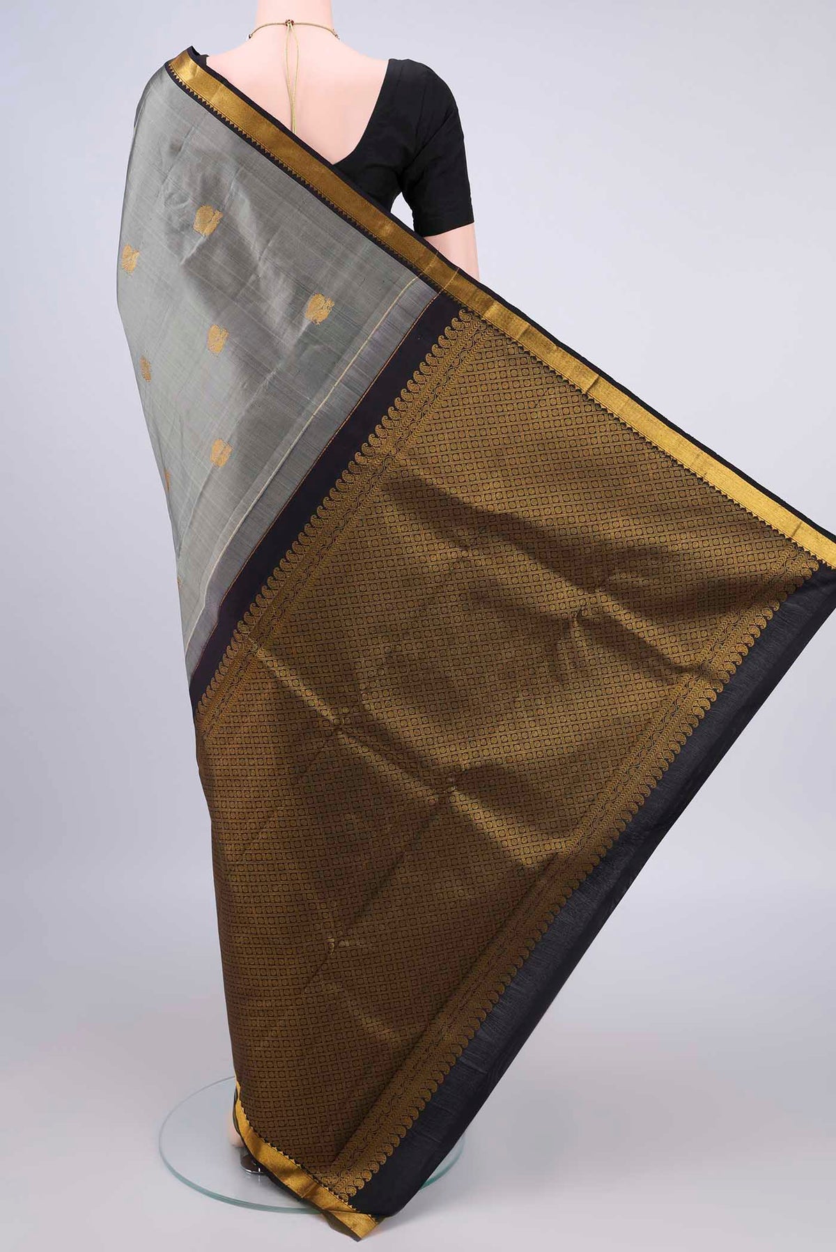 Flat view of Pure Silk Grey Kanchipuram Saree with Zari Butta on the body and Zari Border. 