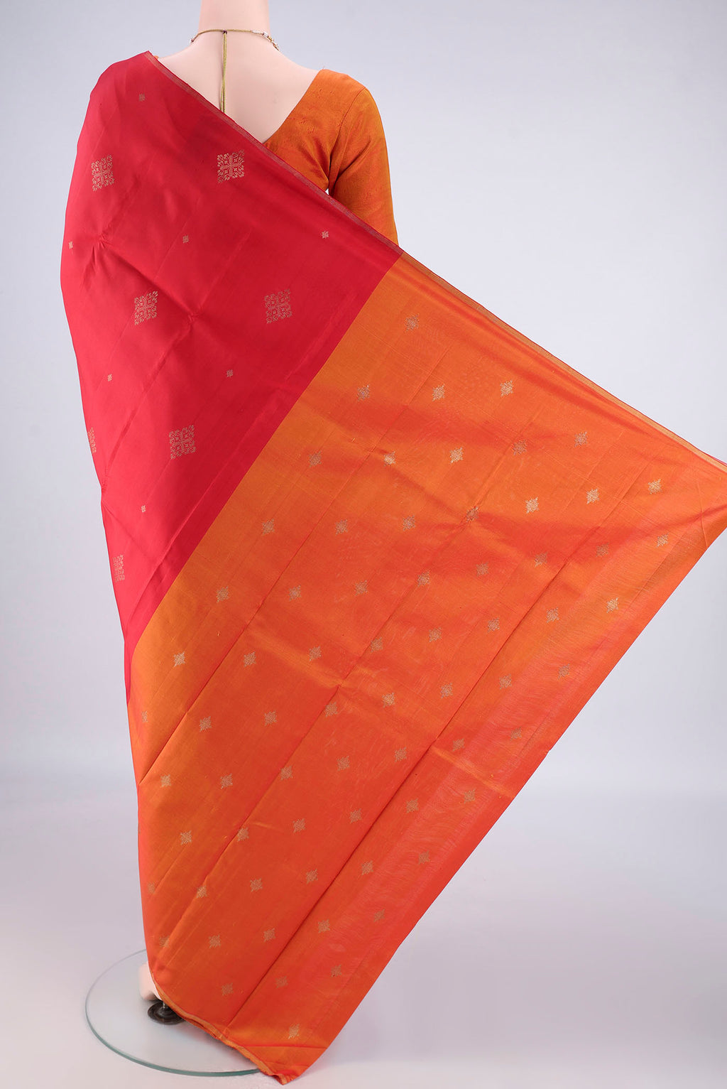 Flat view of Pure Silk Pure Zari Red Kanchipuram Saree with Zari Butta on the body and Plain Border. 