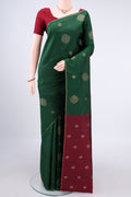 Pure Silk Pure Zari Bottle Green Kanchipuram Saree with Zari Butta on the body and Zari Border.  displayed on a mannequin