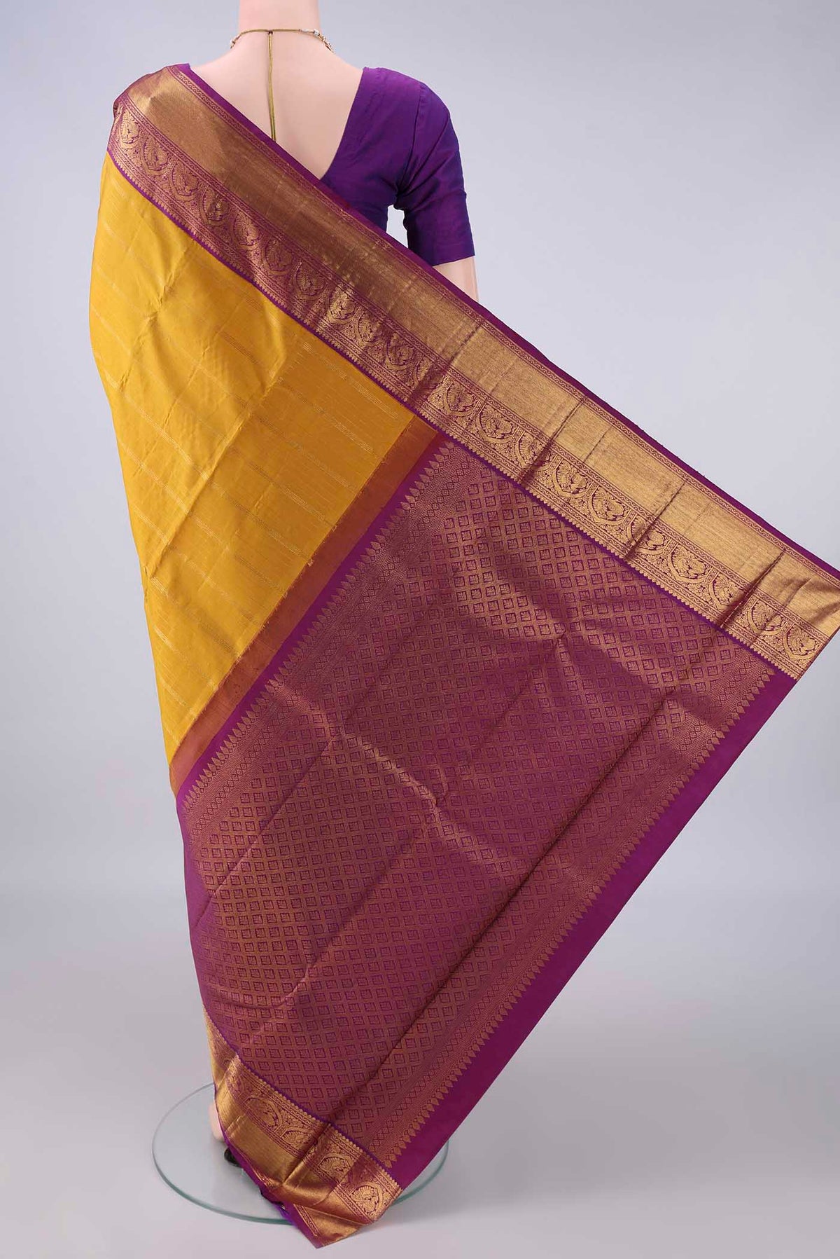 Flat view of Pure Silk Mustard Kanjivaram Saree with Stripes on the body and Zari Border. 