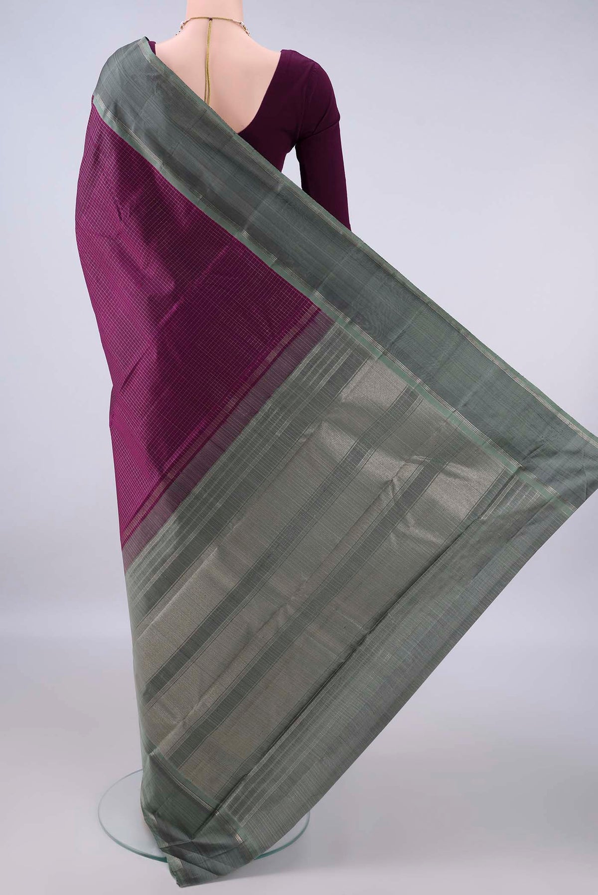 Flat view of Pure Silk Purple Kanchipuram Saree with Checked design on the body and Zari Border. 