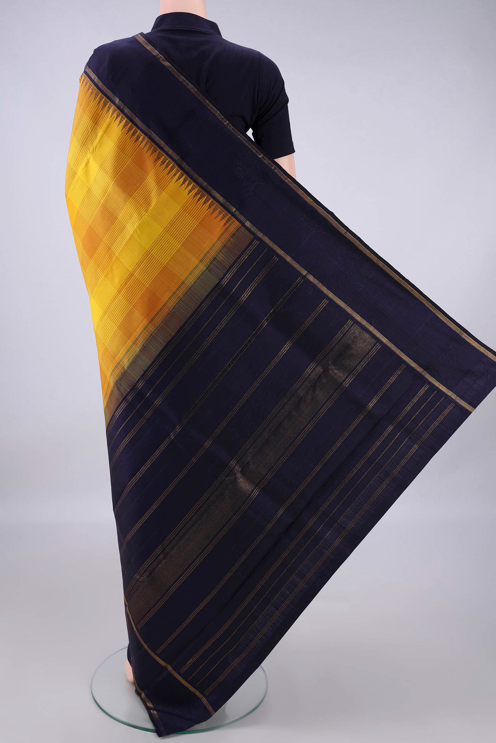 Flat view of Pure Silk Yellow Kanjivaram Saree with Checked design on the body and Zari Border. 
