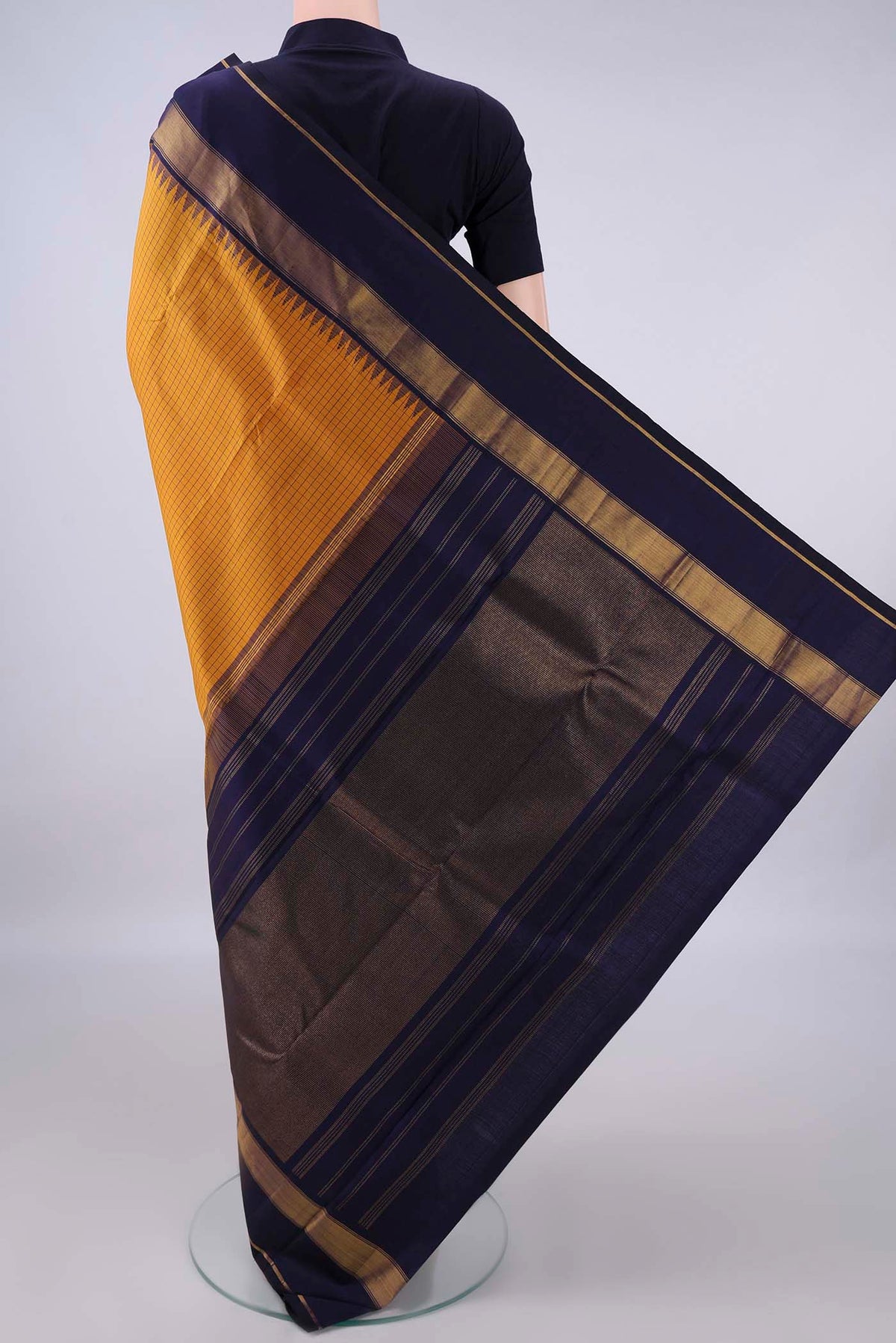 Flat view of Pure Silk Mustard Kanjivaram Saree with Checked design on the body and Zari Border. 