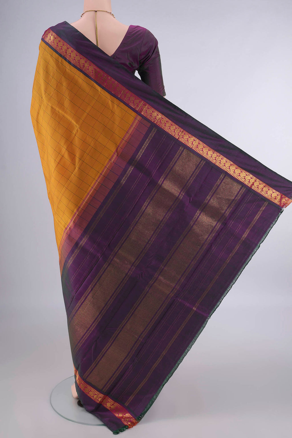 Flat view of Pure Silk Mustard Kanjivaram Saree with Checked design on the body and Zari Border. 
