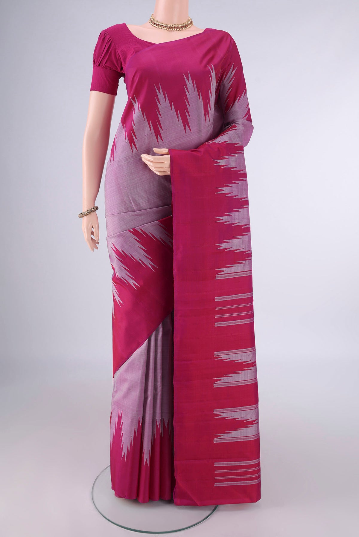 Pure Silk Mauve Kanchipuram Saree with Plain Body and Temple Border.  displayed on a mannequin