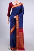 Pure Silk Dark Blue Kanjivaram Saree with Zari Butta on the body and Zari Border.  displayed on a mannequin