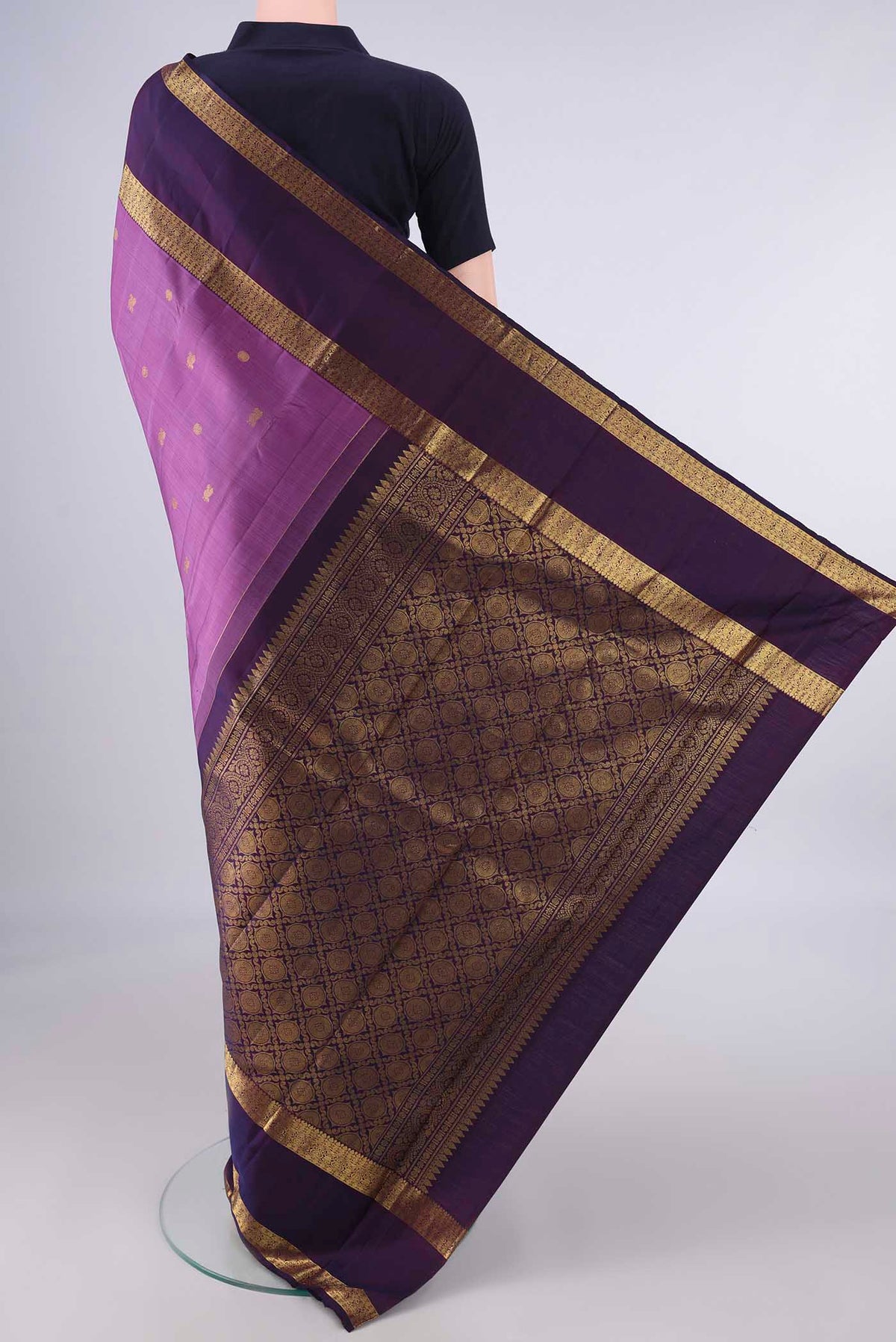Flat view of Pure Silk Light Magenta Kanjivaram Saree with Zari Butta on the body and Zari Border. 