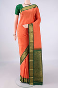 Pure Silk Brick Orange Kanjivaram Saree with Plain Body and Zari Border.  displayed on a mannequin