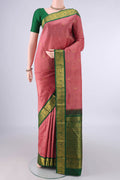 Pure Silk Coral Dual Tone Kanjivaram Saree with Zari Butta on the body and Zari Border.  displayed on a mannequin