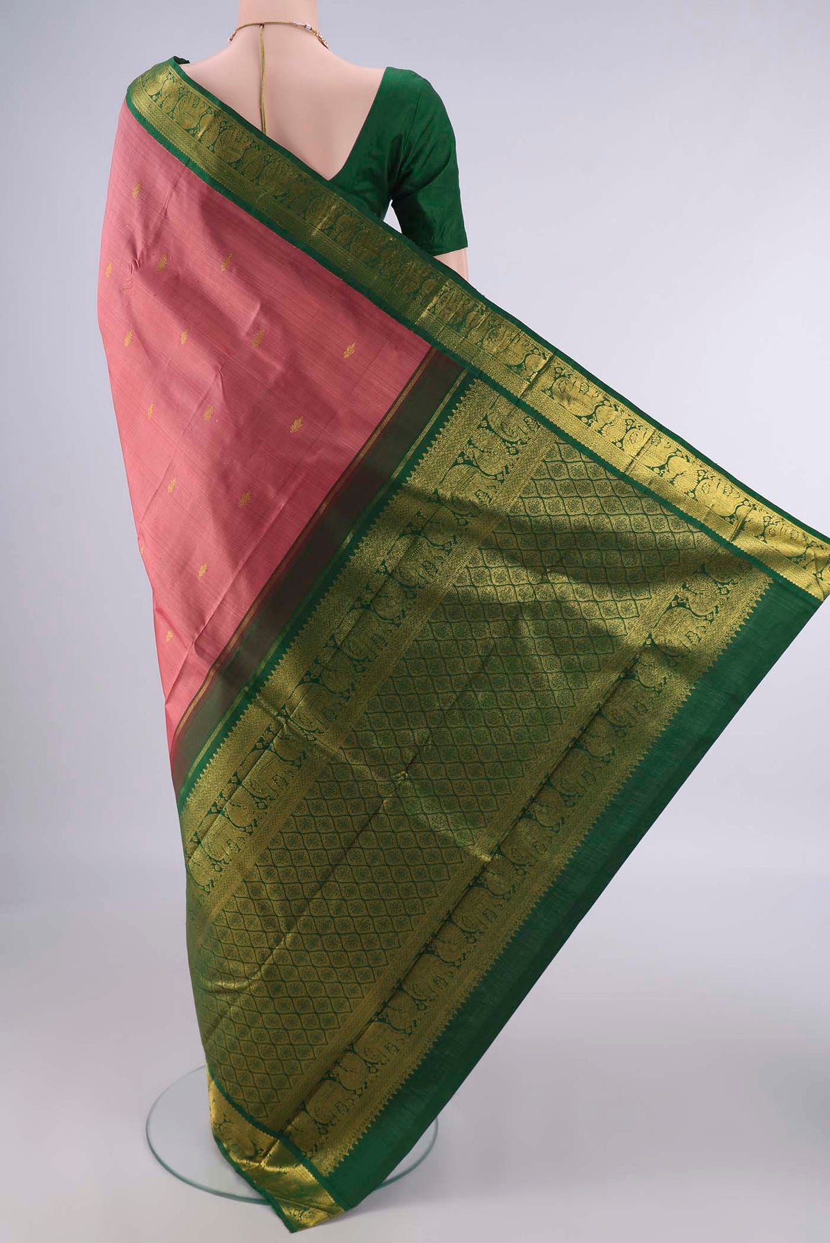 Flat view of Pure Silk Coral Dual Tone Kanjivaram Saree with Zari Butta on the body and Zari Border. 