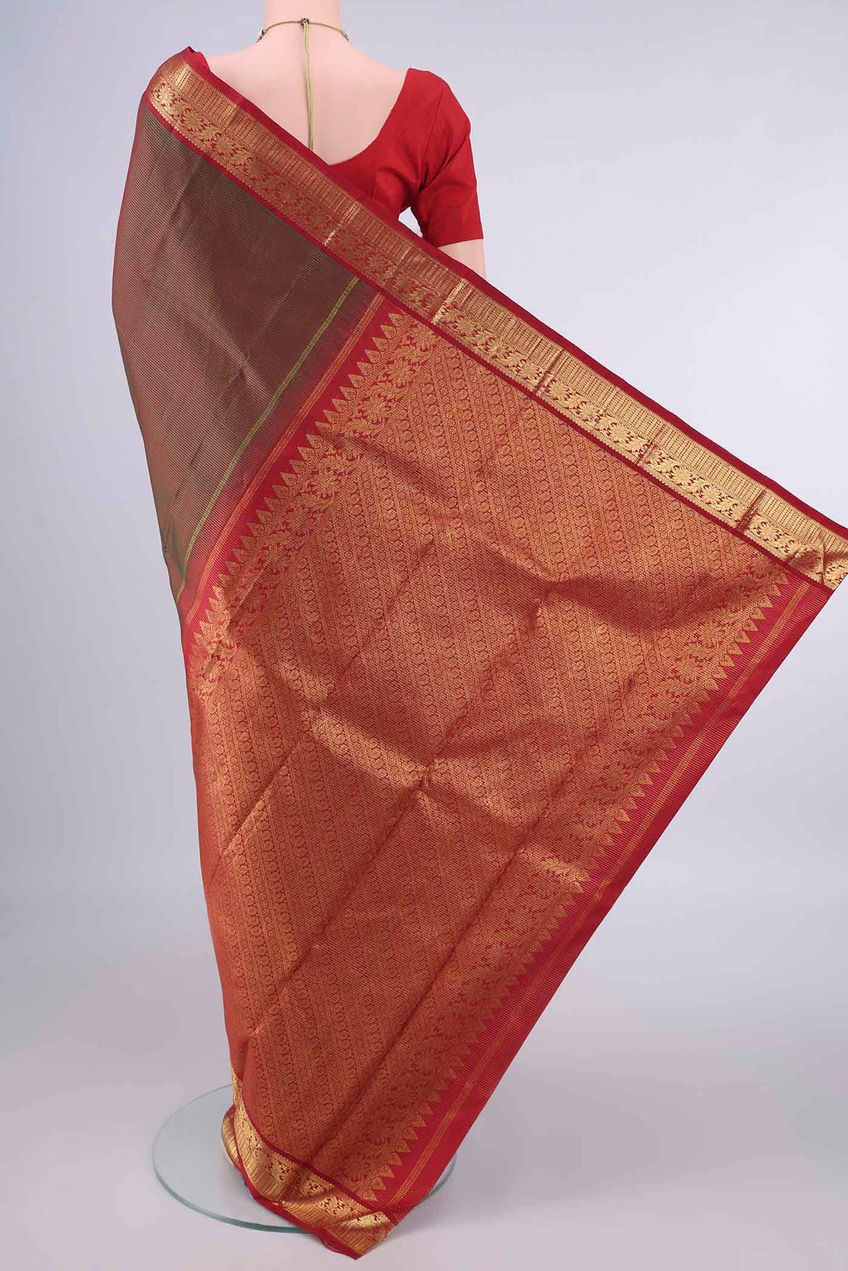 Flat view of Pure Silk Green with Red Color Kanjivaram Saree with Stripes on the body and Zari Border. 