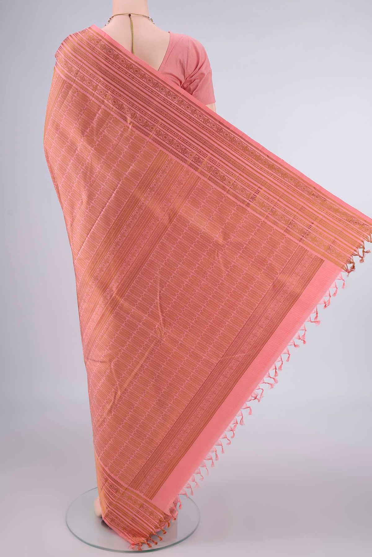 Flat view of Pure Silk Peach Kanjivaram Saree with Jacquard design on the body and Thread Border. 