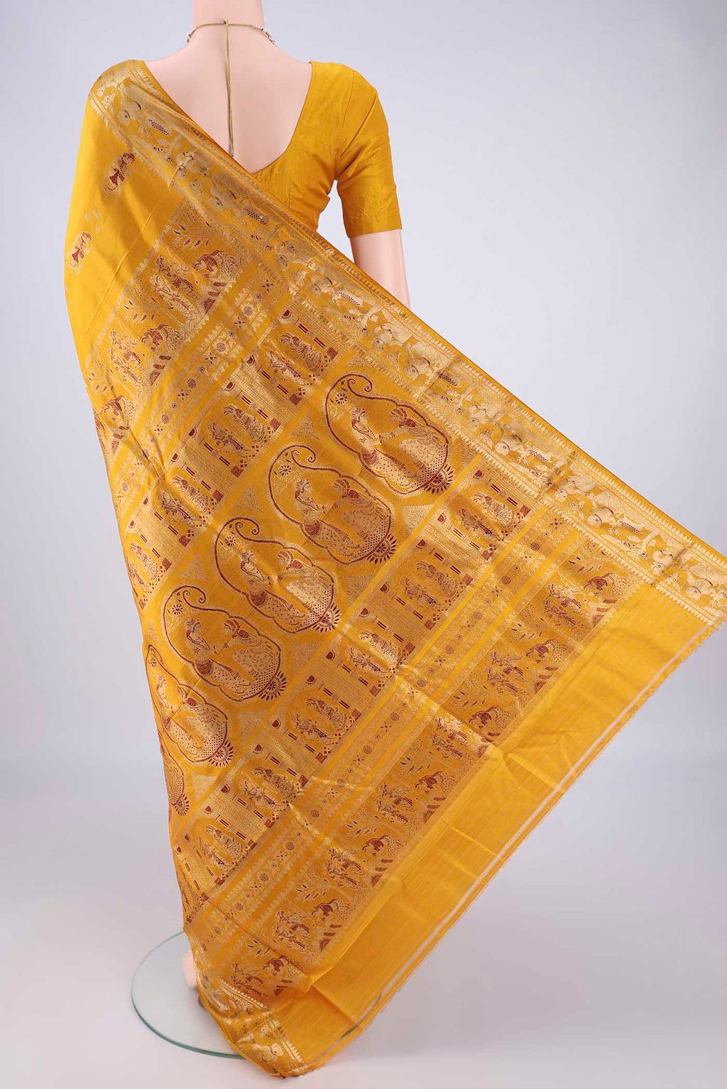 Flat view of Mustard Baluchari Silk Saree with Zari And Thread Butta on the body and Zari And Thread Border. 