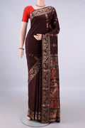 Pure Silk Coffee Brown Baluchari Saree with Zari And Thread Butta on the body and Zari Border.  displayed on a mannequin