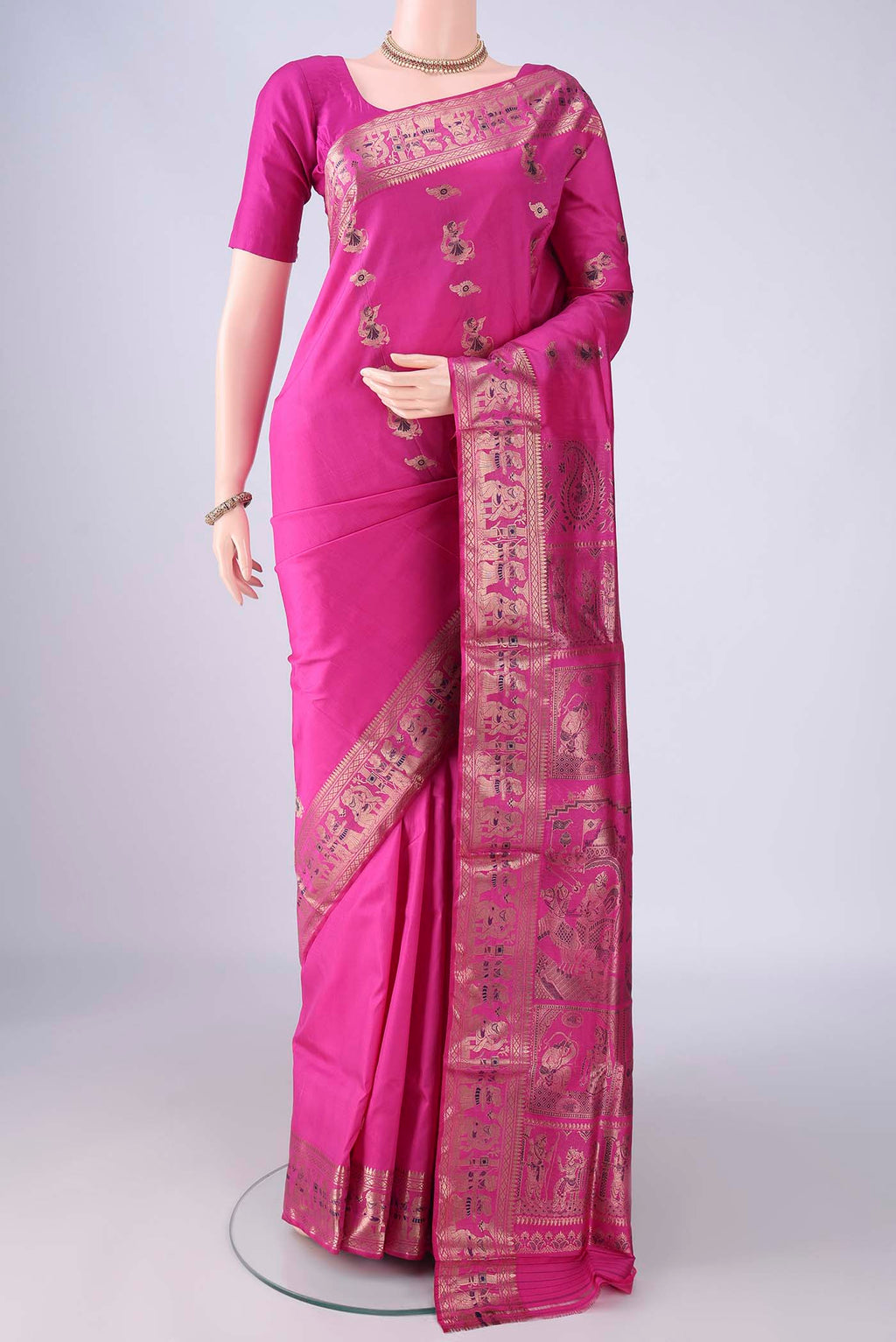 Rani Pink Dual Tone Baluchari Silk Saree with Zari And Thread Butta on the body and Zari And Thread Border.  displayed on a mannequin