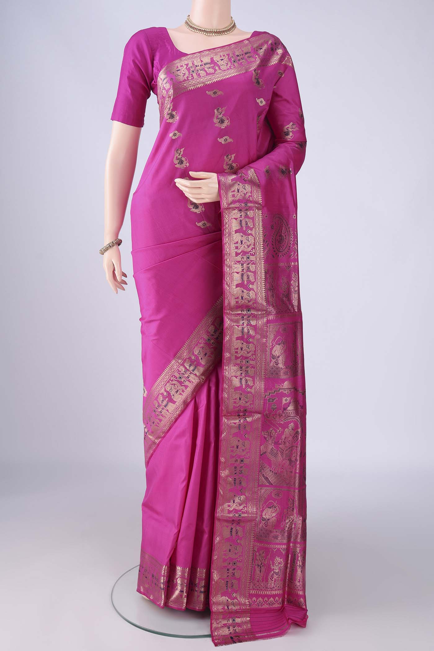 Rani Pink Dual Tone Baluchari Silk Saree with Zari And Thread Butta on the body and Zari And Thread Border.  displayed on a mannequin