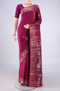 Magenta Baluchari Silk Saree with Zari And Thread Butta on the body and Zari And Thread Border.  displayed on a mannequin