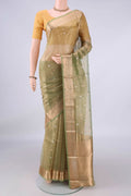 Pista Green Organza Saree with Zari Butta on the body and Zari Border.  displayed on a mannequin
