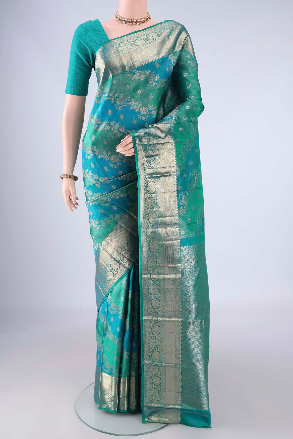 Blue Dual Tone Kanjivaram Silk Saree with Zari Brocade on the body and Zari Border.  displayed on a mannequin