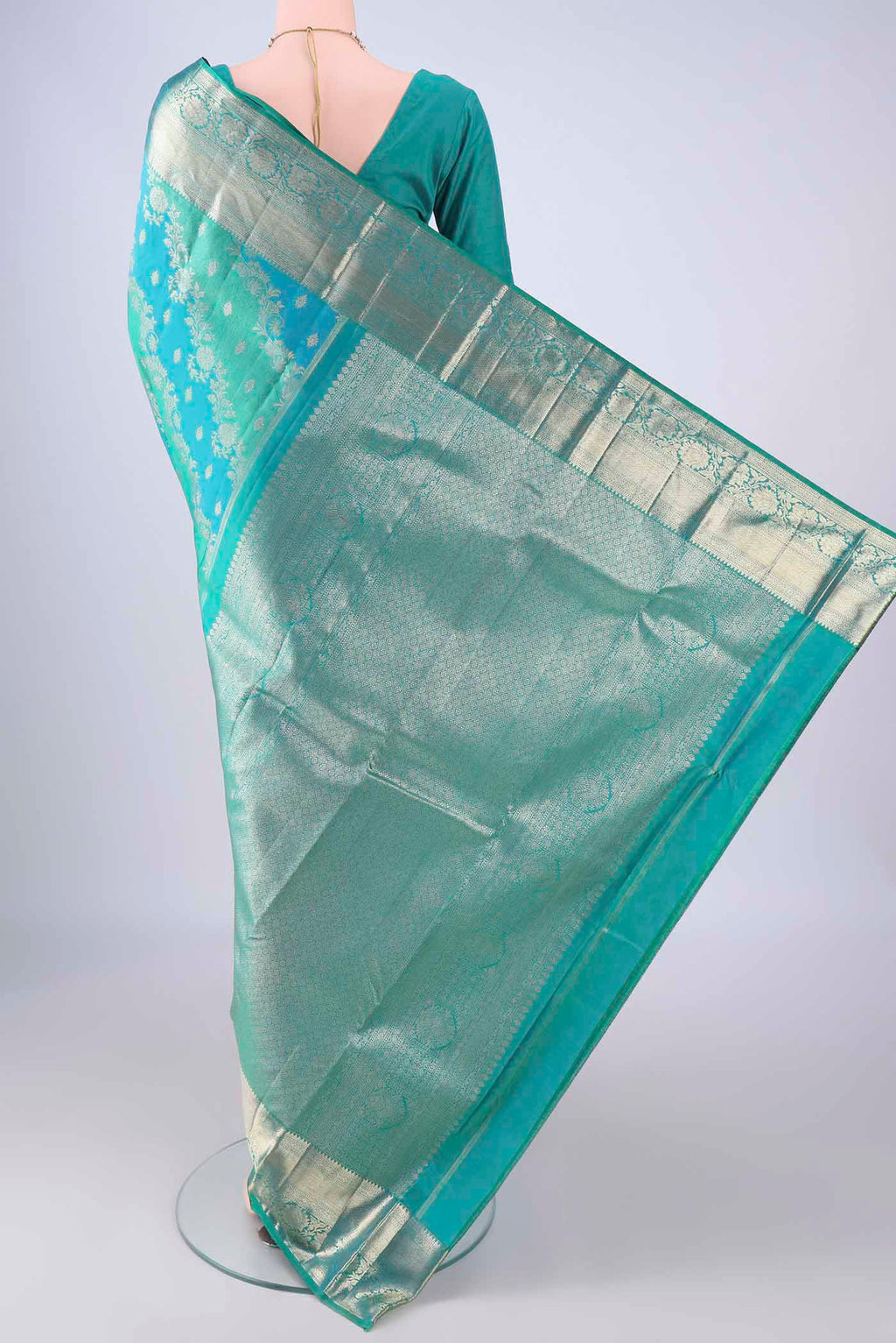 Flat view of Blue Dual Tone Kanjivaram Silk Saree with Zari Brocade on the body and Zari Border. 
