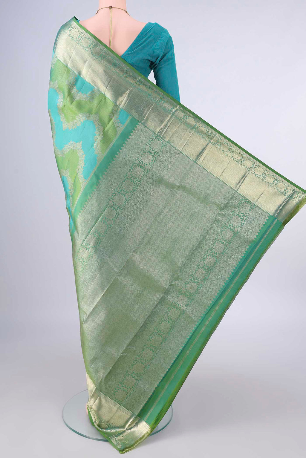Flat view of Pure Silk Multi Color Kanjivaram Saree with Zari Butta on the body and Zari Border. 