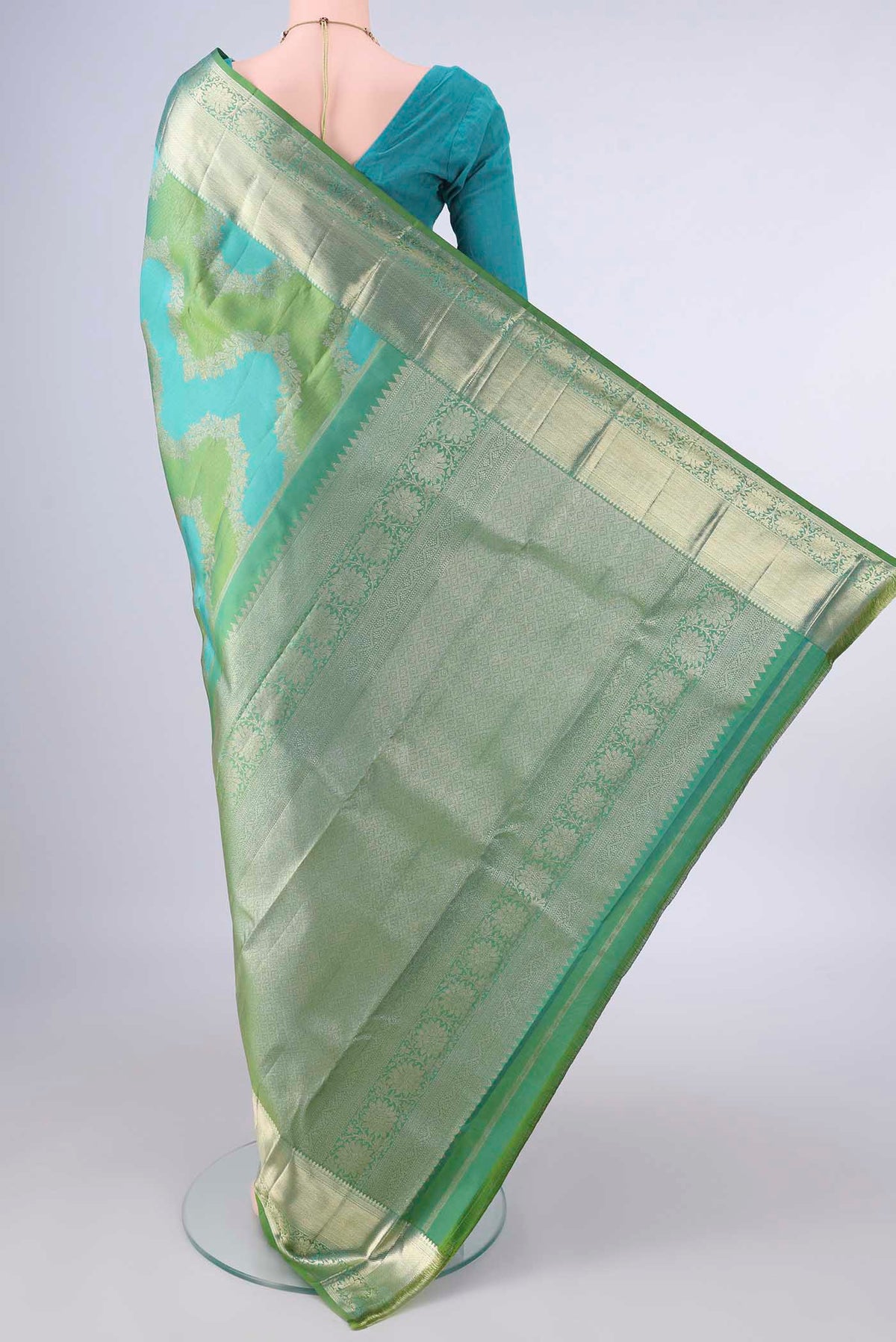 Flat view of Pure Silk Multi Color Kanjivaram Saree with Zari Butta on the body and Zari Border. 