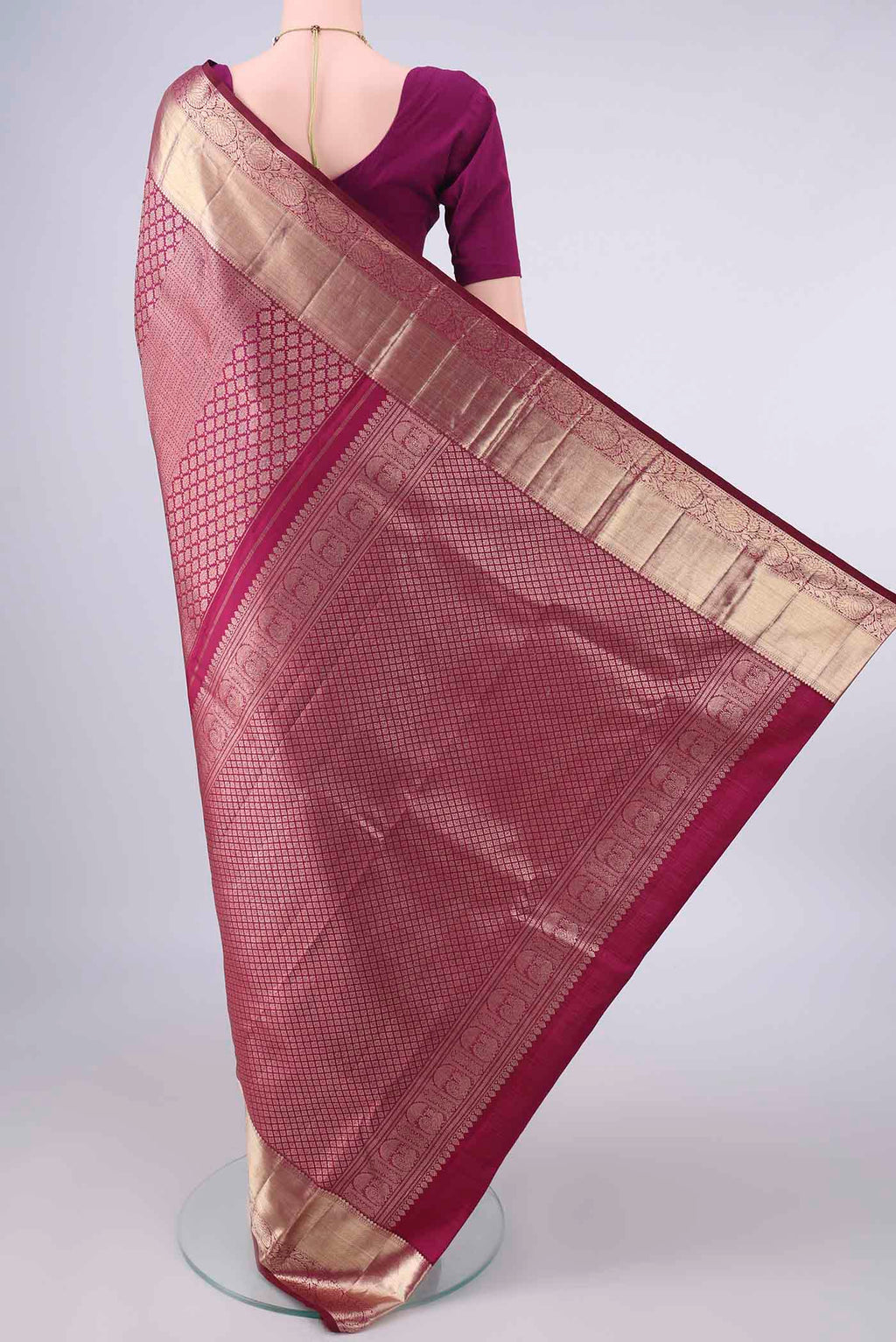 Flat view of Pure Silk Maroon Kanjivaram Saree with Zari Brocade on the body and Zari Border. 