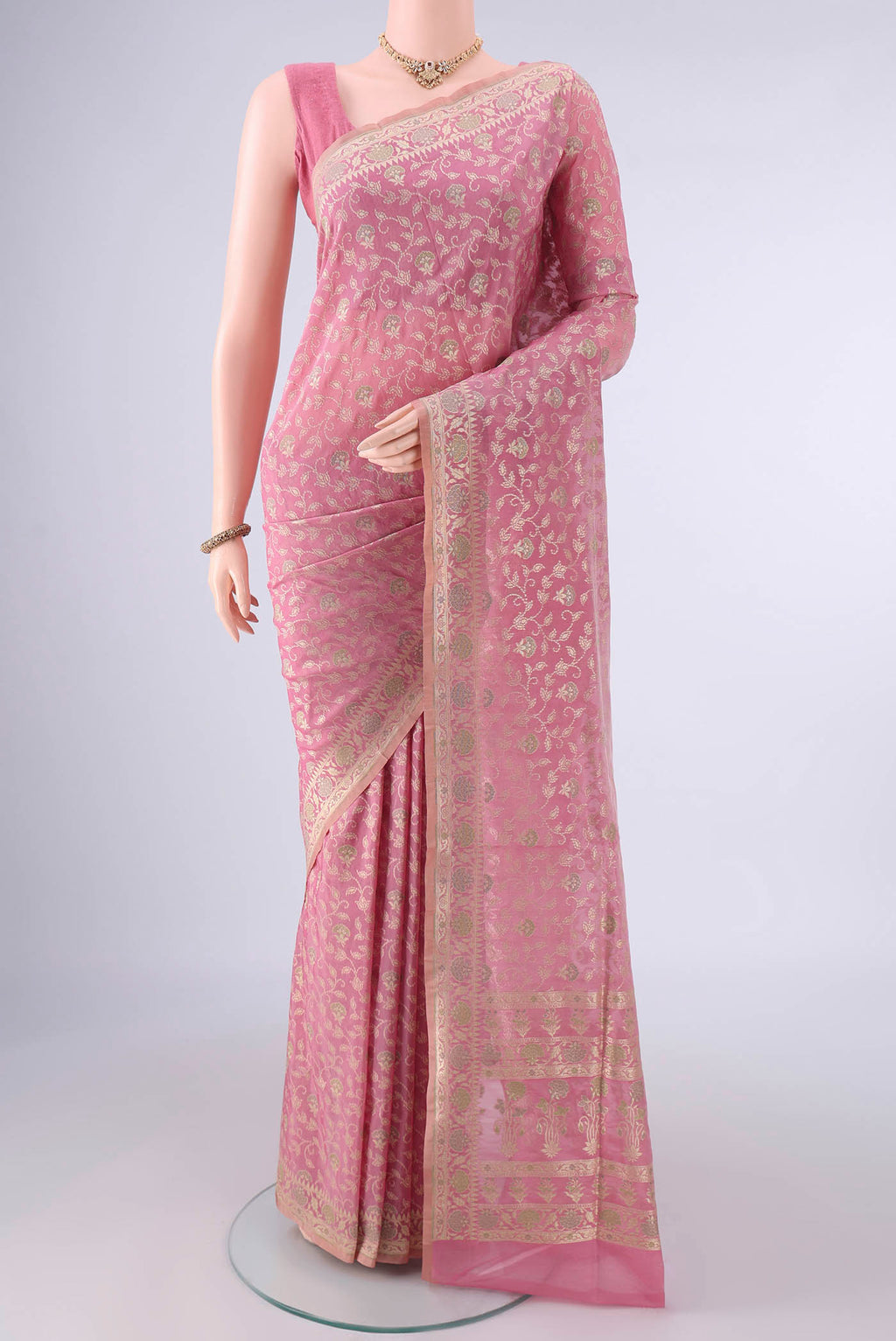 Pure Silk Peach Banarasi Saree with Thread Brocade on the body and Zari And Thread Border.  displayed on a mannequin