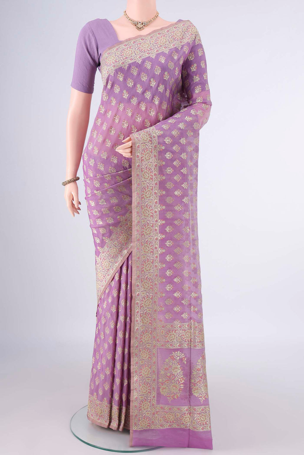 Pure Silk Lavender Banarasi Saree with Zari And Thread Butta on the body and Zari Border.  displayed on a mannequin