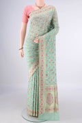 Pure Silk Light Green Banarasi Saree with Zari And Thread Butta on the body and Zari Border.  displayed on a mannequin