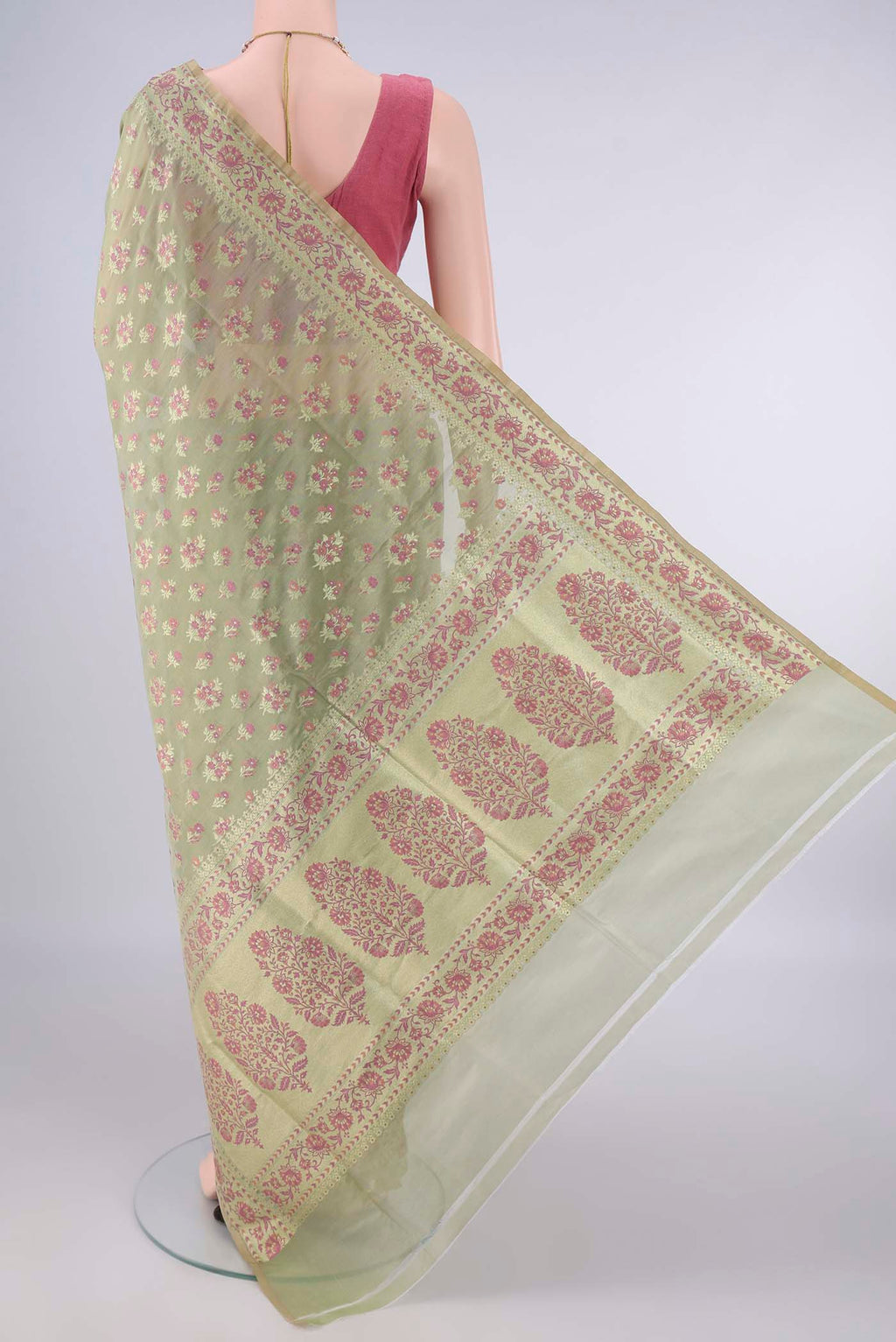 Flat view of Light Green Banarasi Saree with Zari And Thread Butta on the body and Zari And Thread Border. 