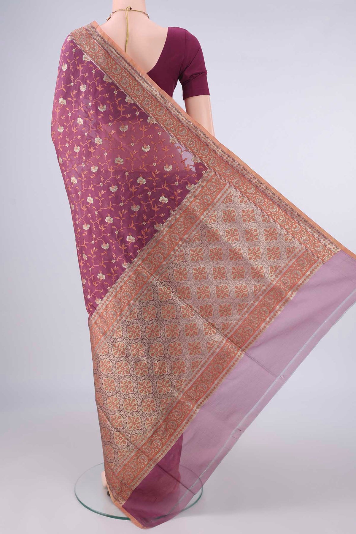 Flat view of Pure Silk Mauve Banarasi Saree with Thread Butta on the body and Zari And Thread Border. 
