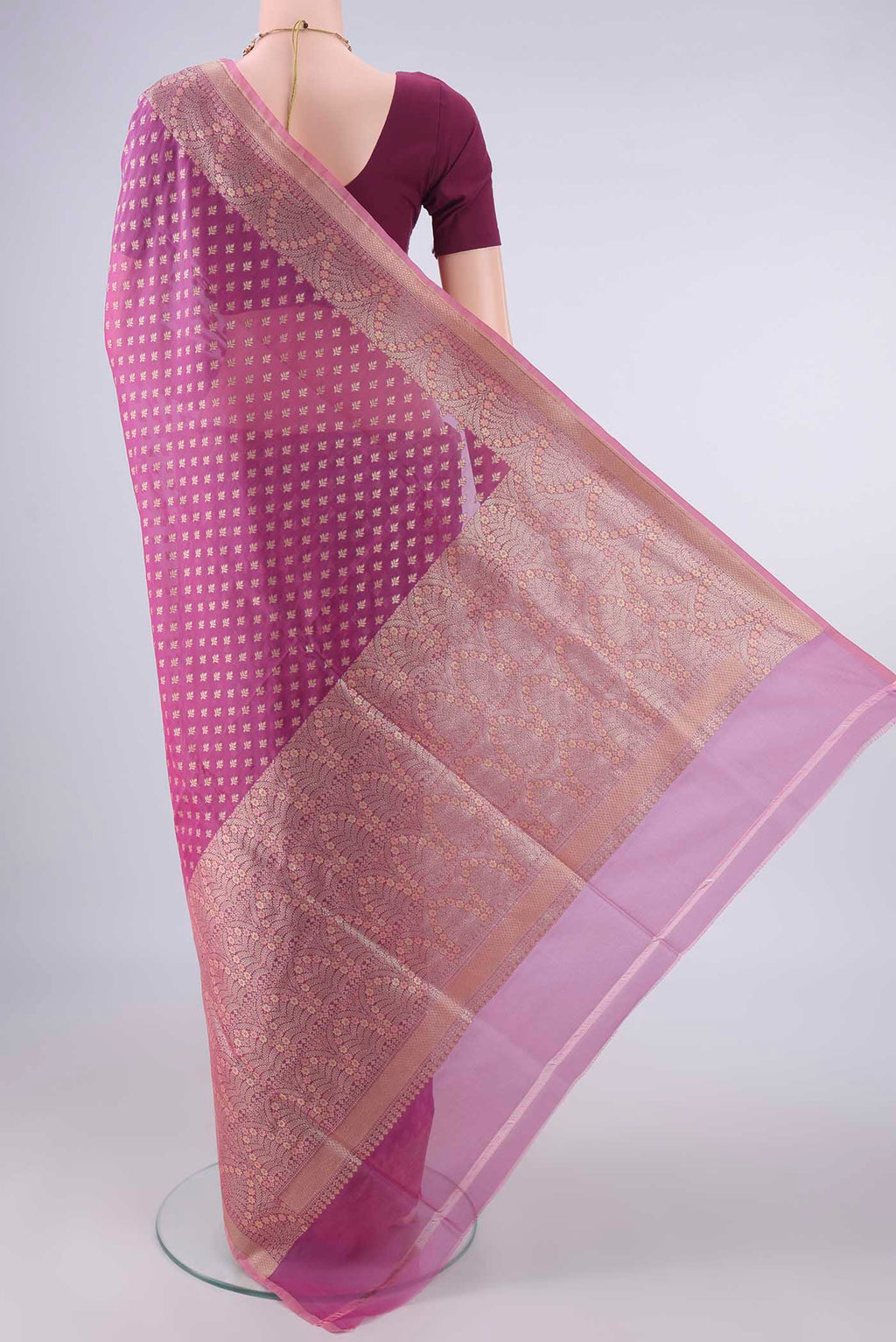 Flat view of Pure Silk Light Magenta Banarasi Saree with Zari And Thread Butta on the body and Zari And Thread Border. 