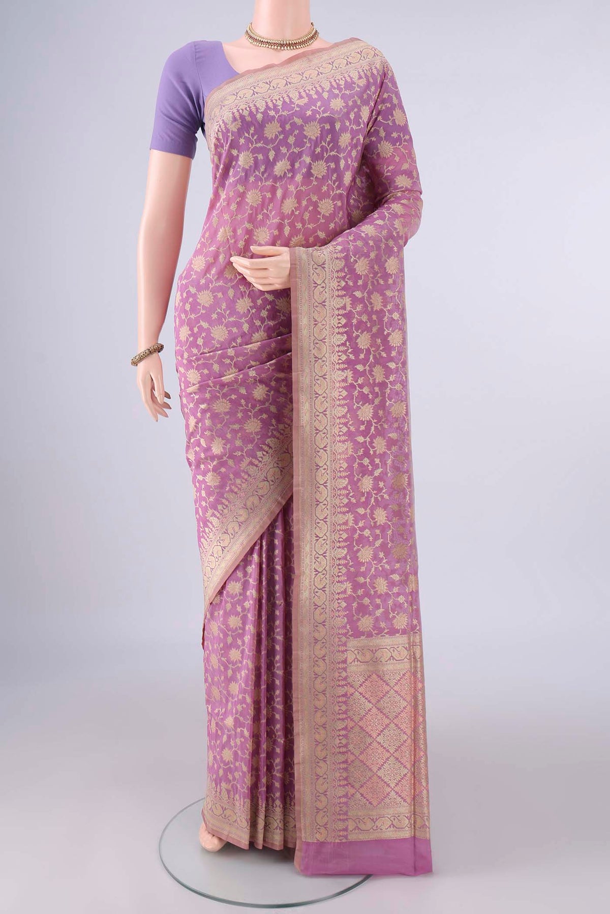 Pure Silk Rose Gold Banarasi Saree with Thread Brocade on the body and Zari Border.  displayed on a mannequin