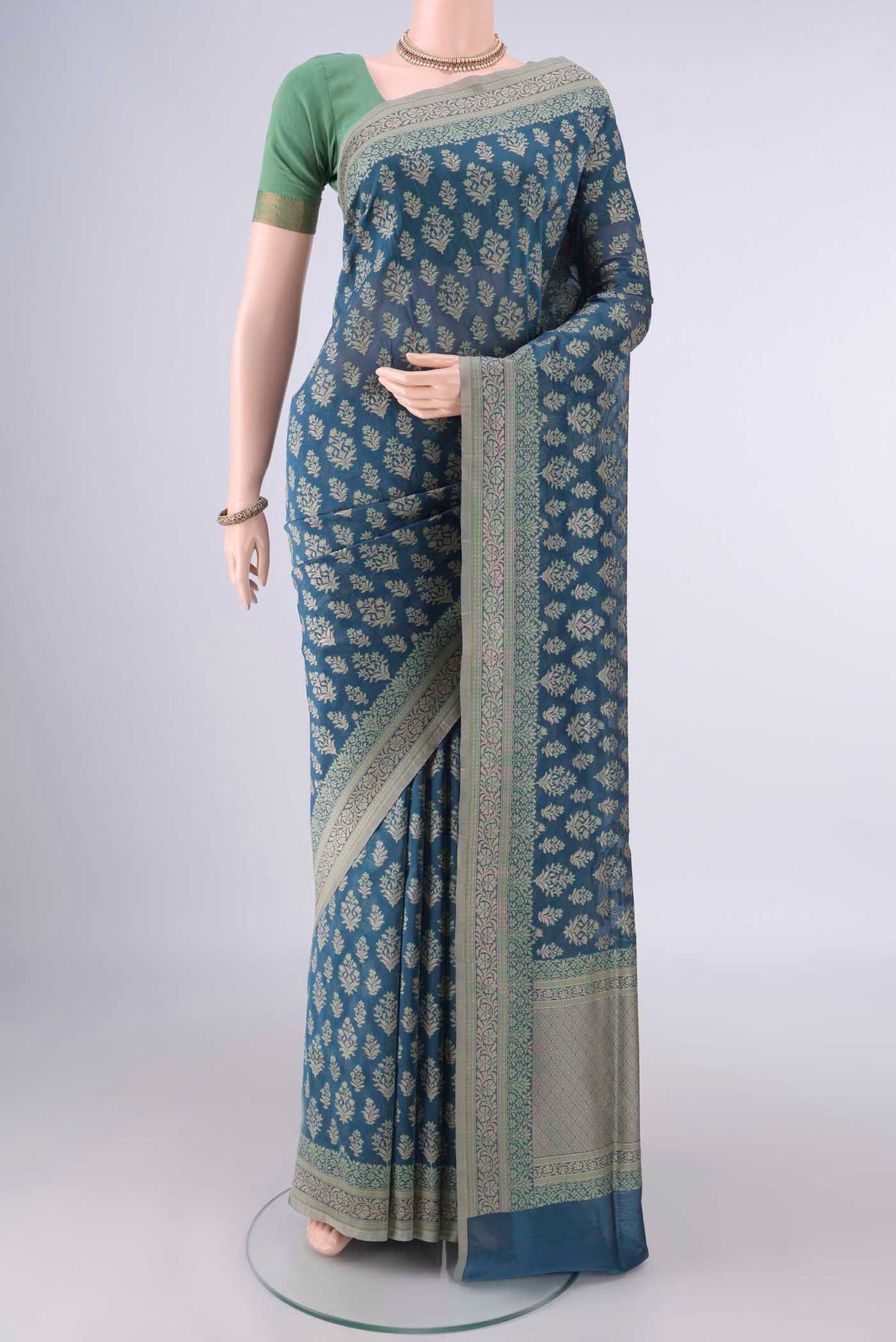 Pure Silk Blue Banarasi Saree with Thread Brocade on the body and Thread Border.  displayed on a mannequin