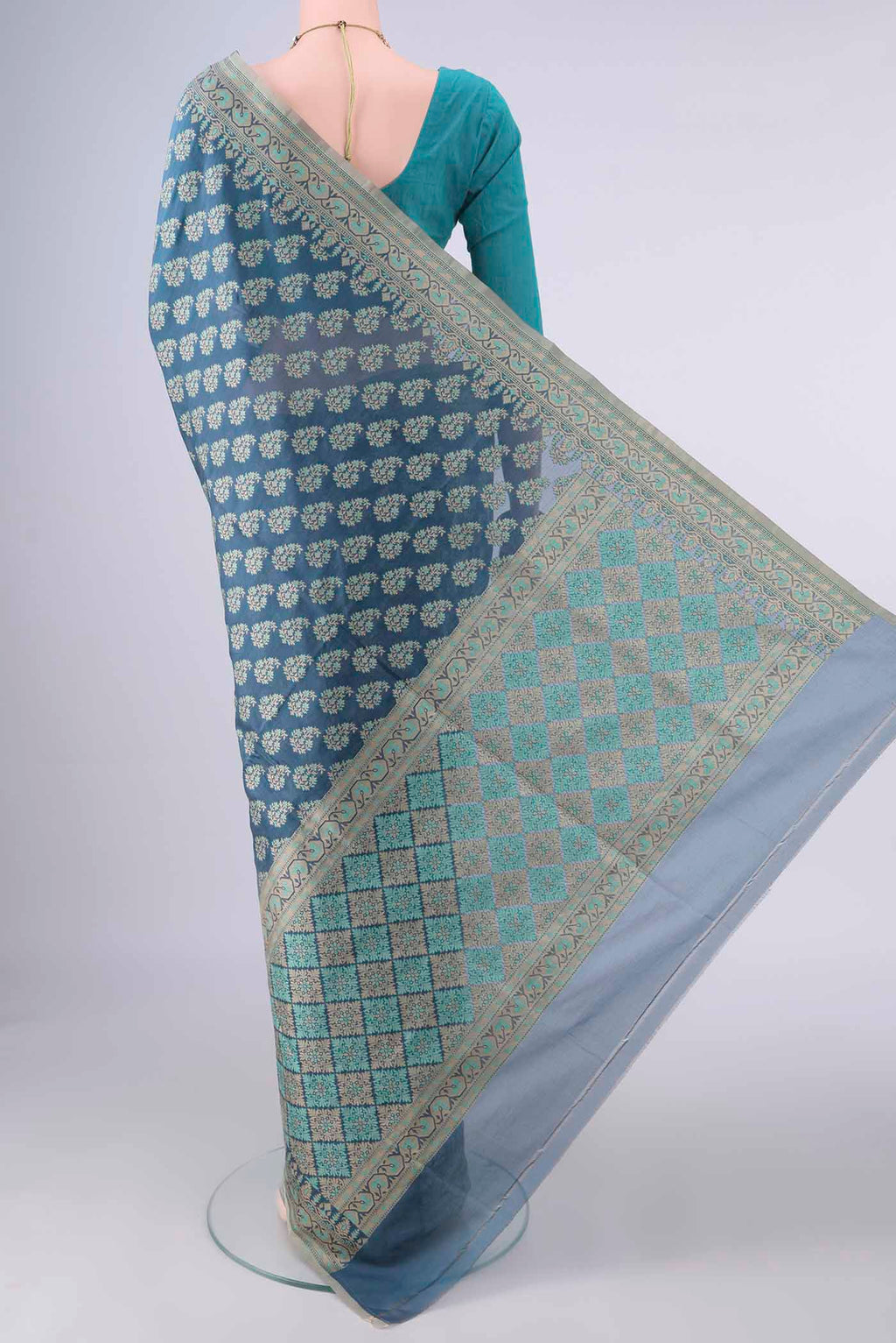 Flat view of Pure Silk Maya Blue Banarasi Saree with Thread Butta on the body and Thread Border. 