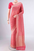 Pure Silk Peach Banarasi Saree with Zari And Thread Butta on the body and Zari Border.  displayed on a mannequin