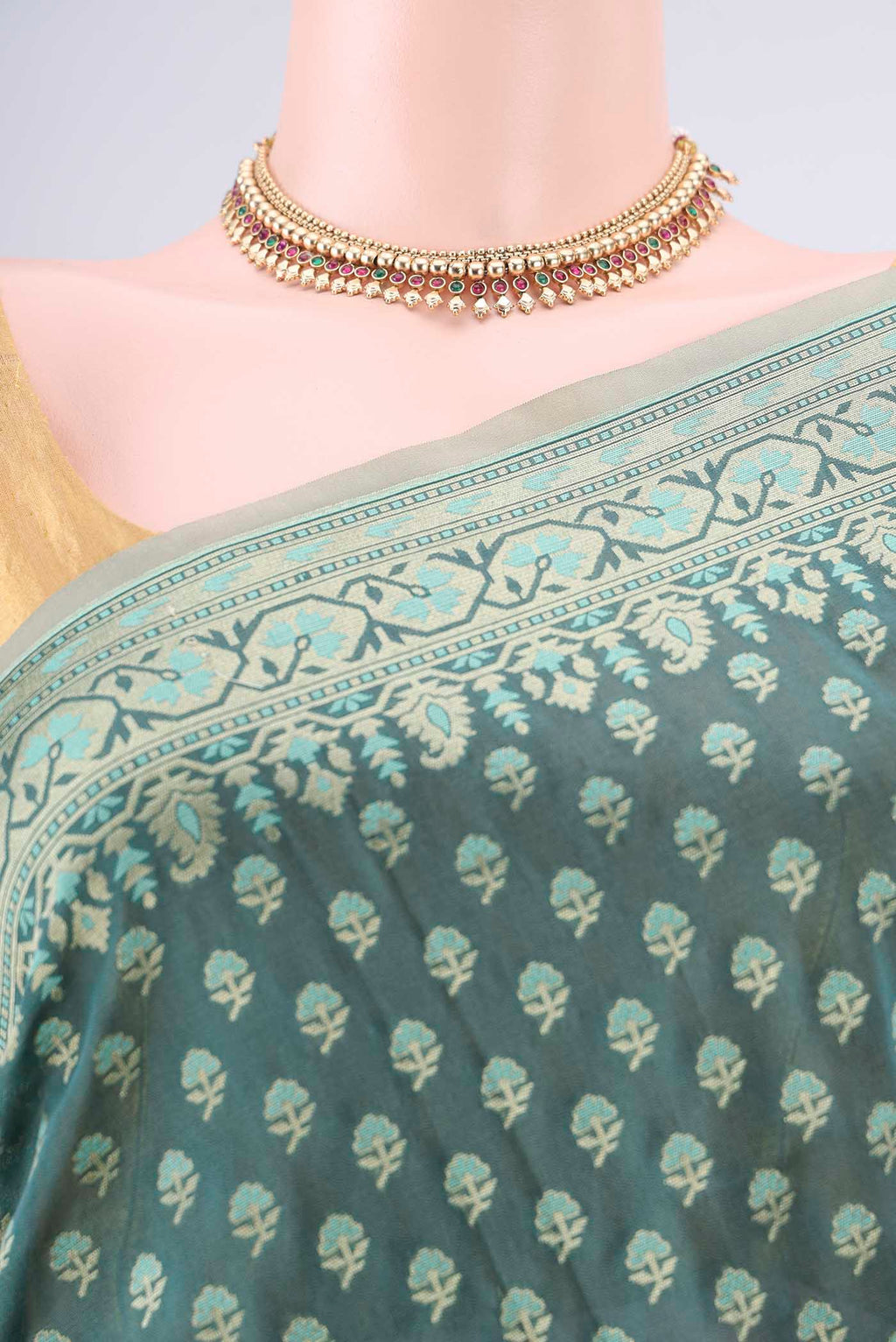 Border image of Pure Silk Teal Banarasi Saree with Zari Butta on the body and Zari Border. 
