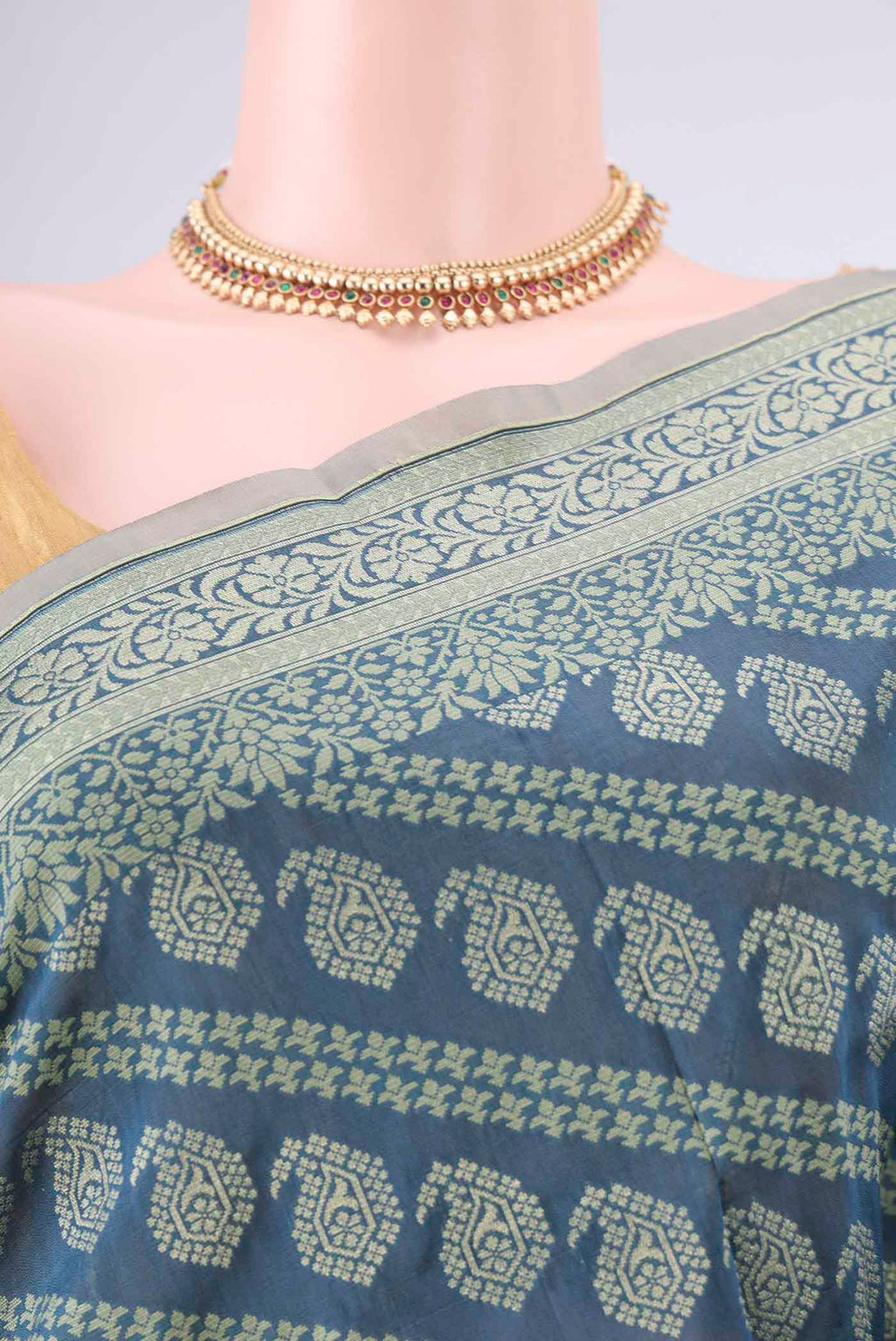 Border image of Pure Silk Teal Banarasi Saree with Zari And Thread Butta on the body and Zari Border. 