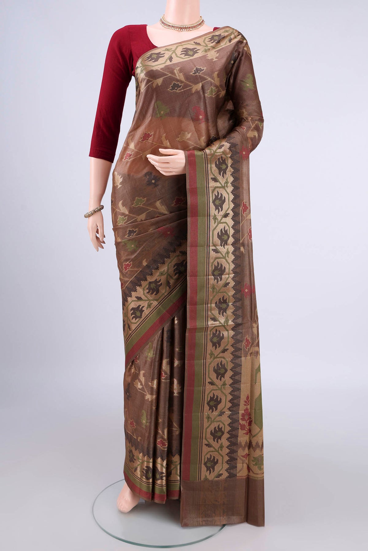 Brown Banarasi Tussar Saree with Zari And Thread Butta on the body and Thread Border.  displayed on a mannequin