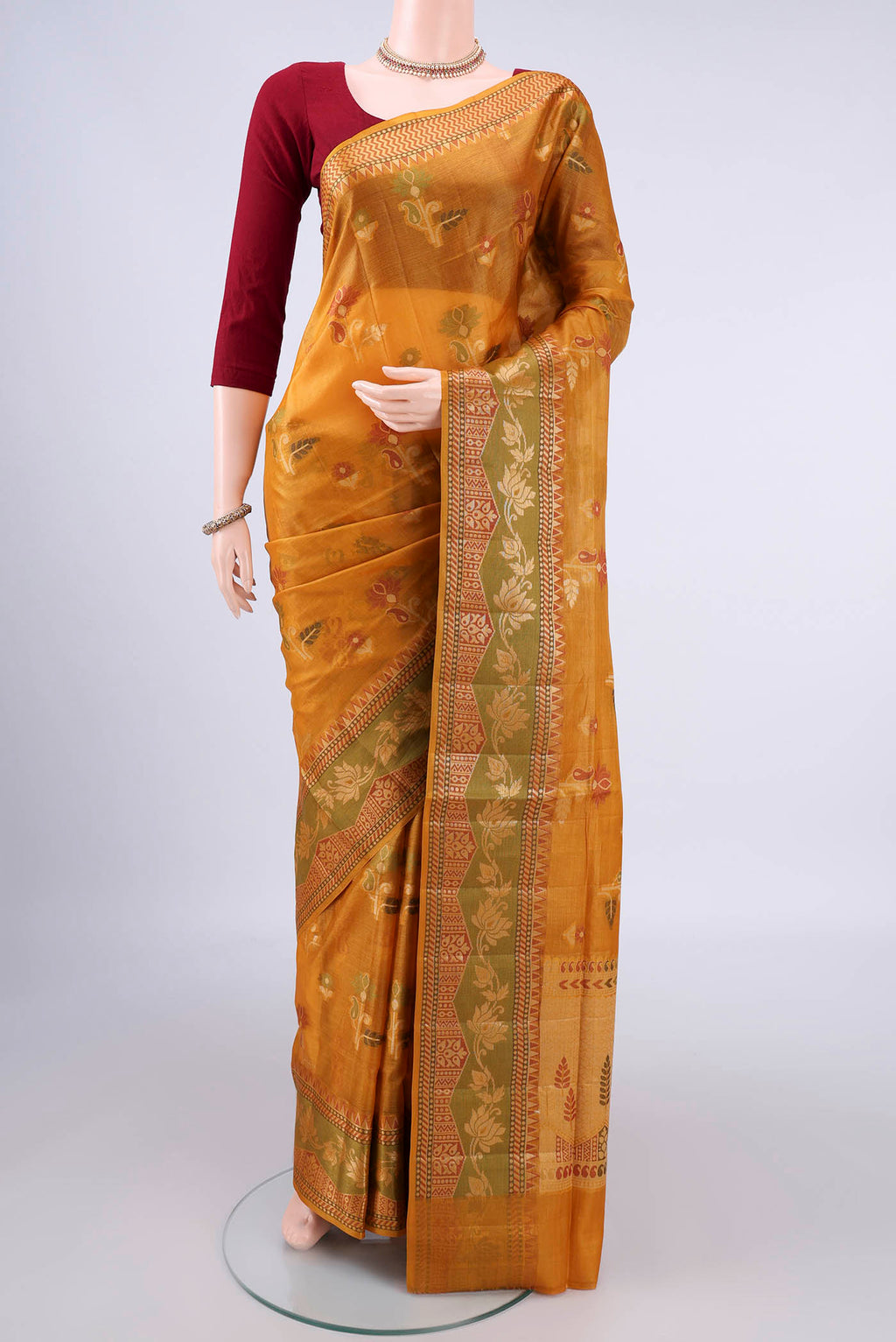 Mustard Banarasi Tussar Saree with Thread Butta on the body and Thread Border.  displayed on a mannequin