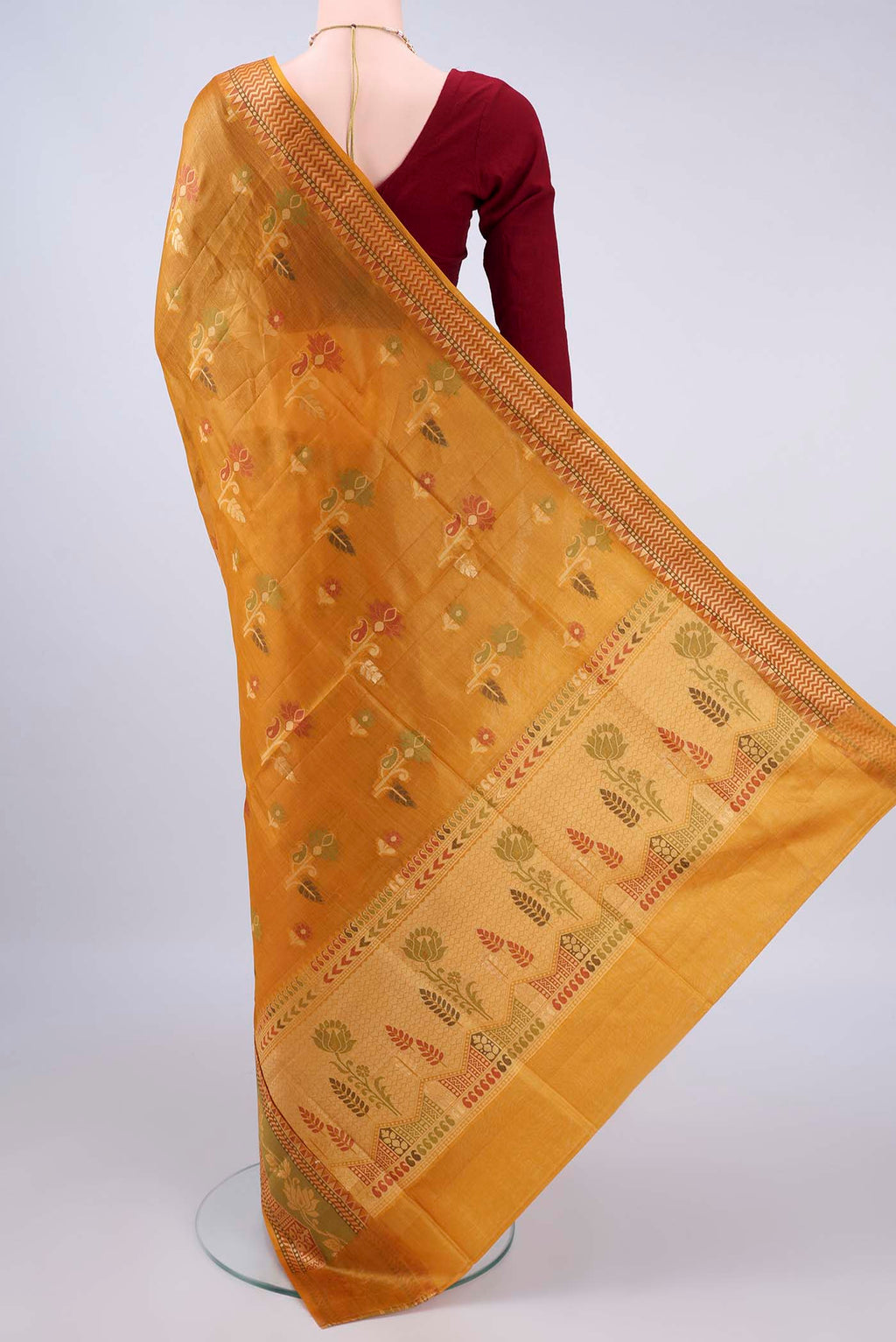 Flat view of Mustard Banarasi Tussar Saree with Thread Butta on the body and Thread Border. 