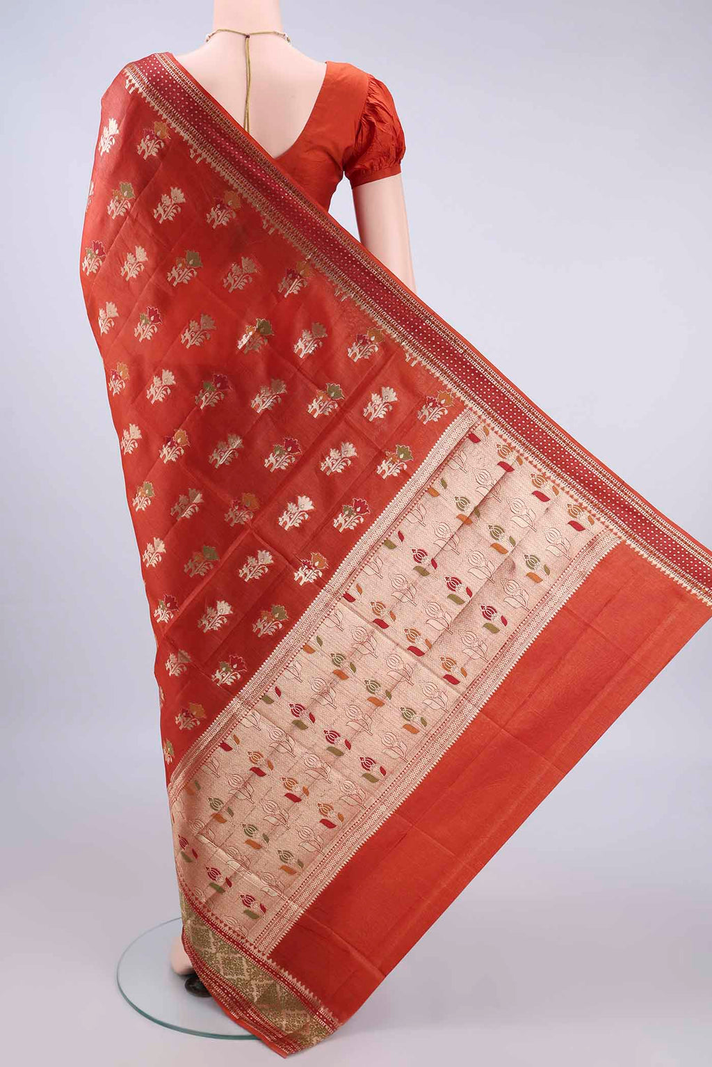 Flat view of Rust Banarasi Tussar Saree with Zari And Thread Butta on the body and Zari Border. 