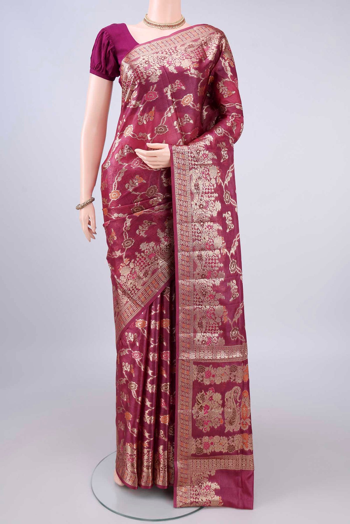 Dark Pink Banarasi Tussar Saree with Zari And Thread Butta on the body and Zari Border.  displayed on a mannequin